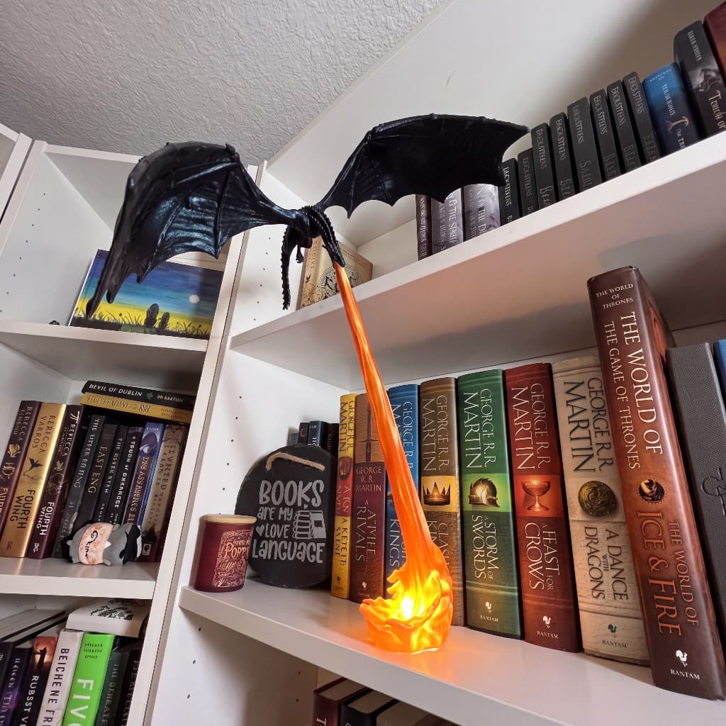Dragon fire lamp on a white bookshelf